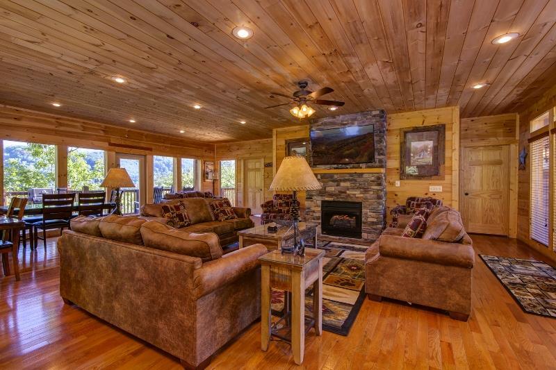 Great room with stone fireplace and large sofas