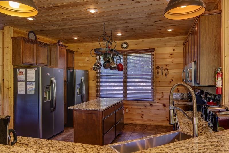 Double kitchen with two refrigerators and two stoves