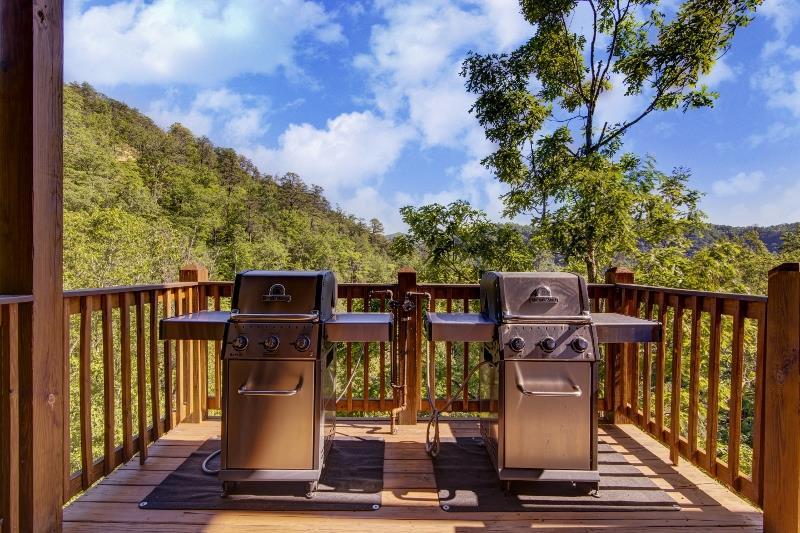 Deck with two gas grills and mountain views